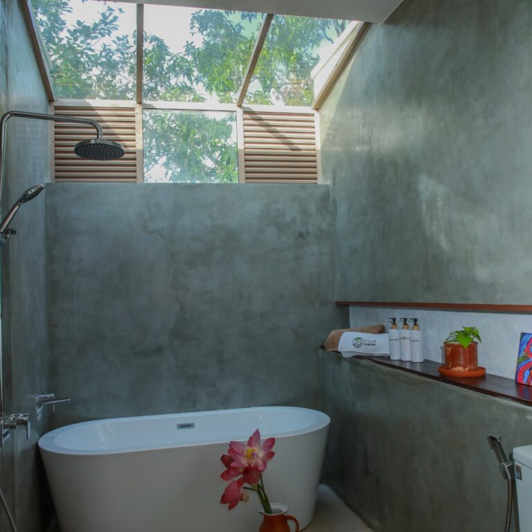 Bathroom with a skylight at Ona Garden Villa