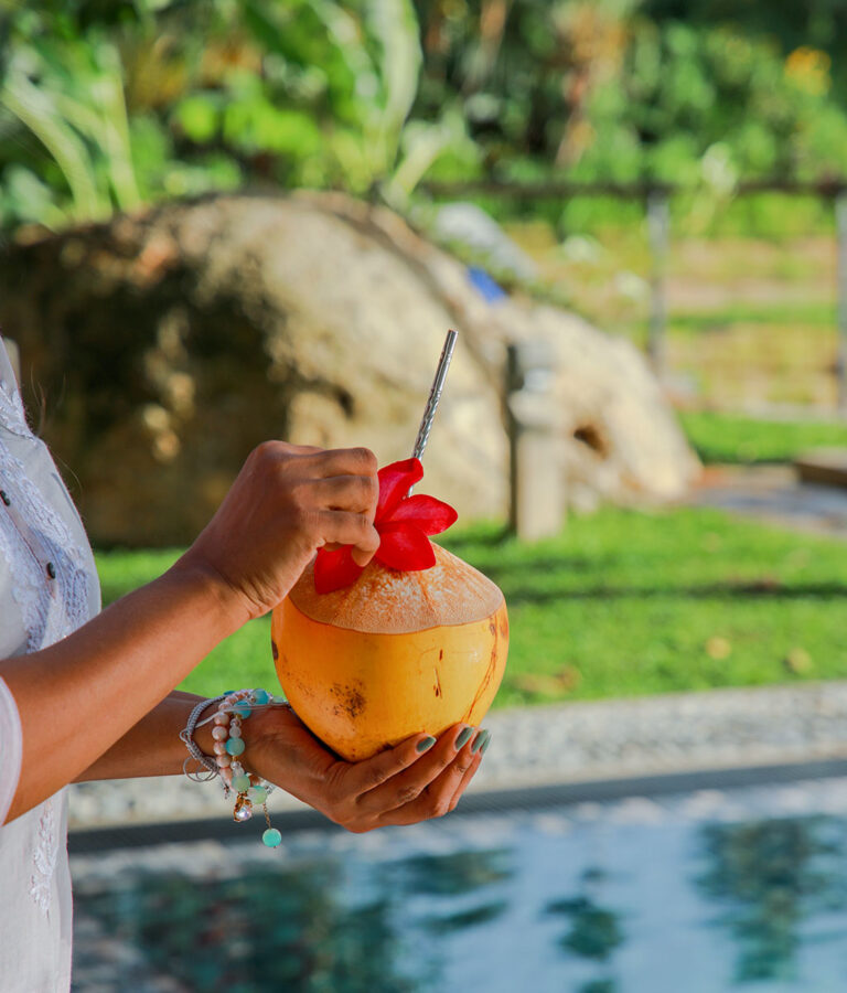 A coconut drink served by the pool