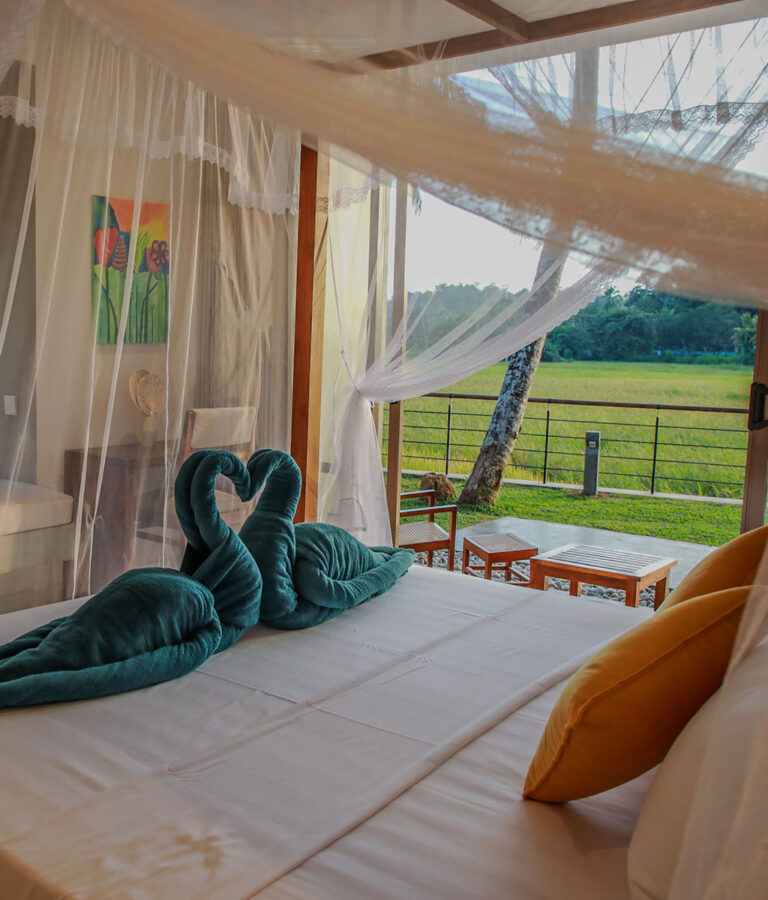 Romantic bed setup with a view at Ona Garden Villa