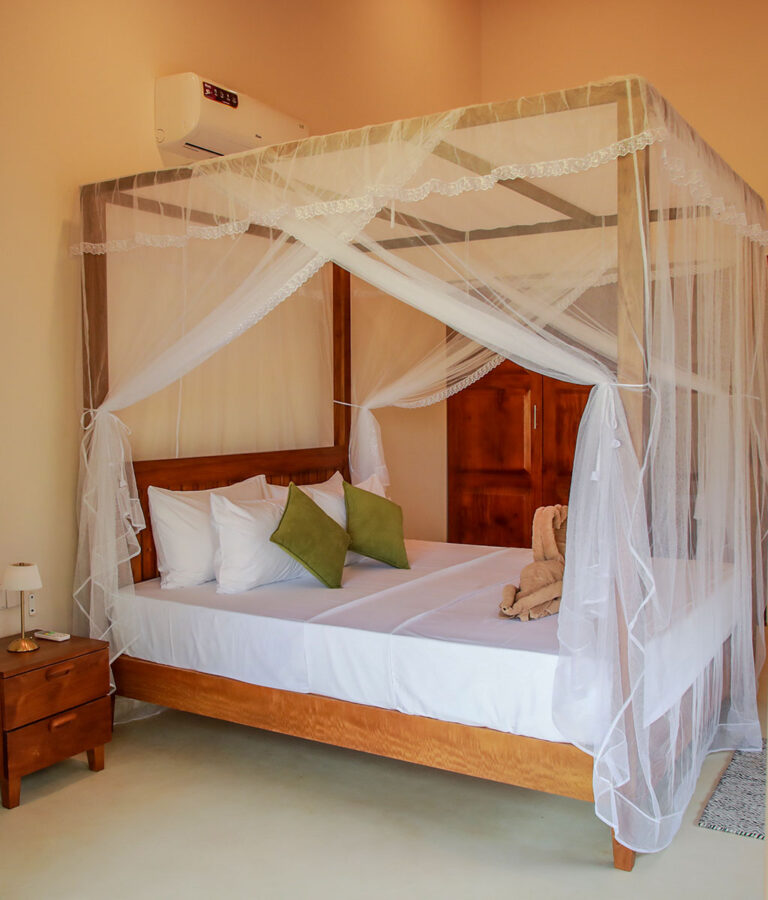 Romantic four poster bed at Ona Garden Villa