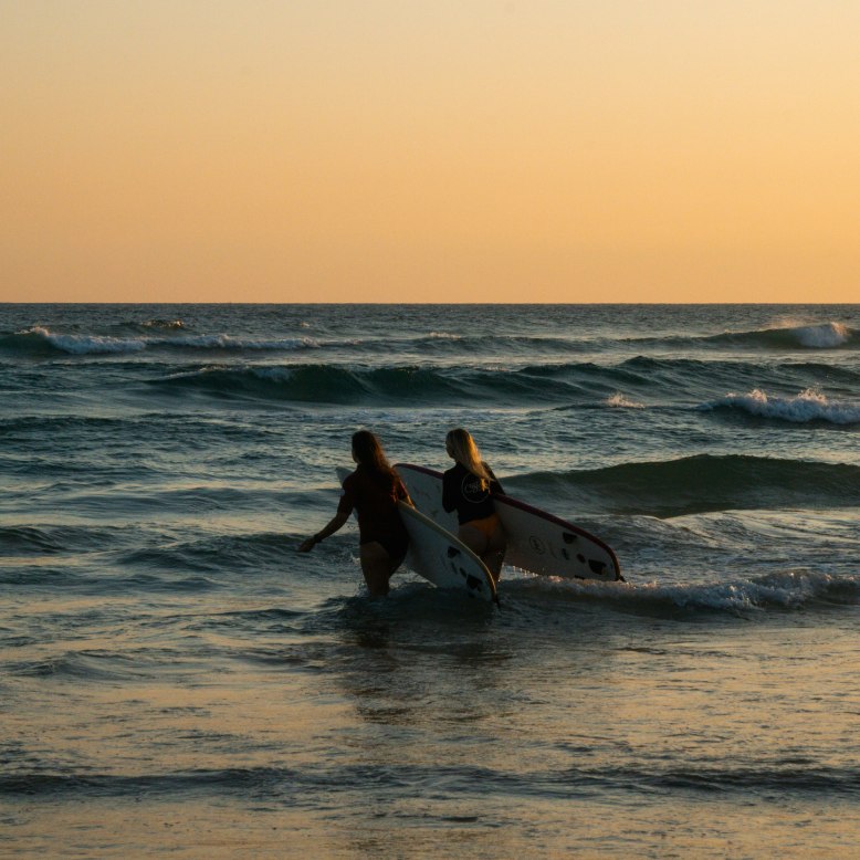 Two guests surfing at Ahangama