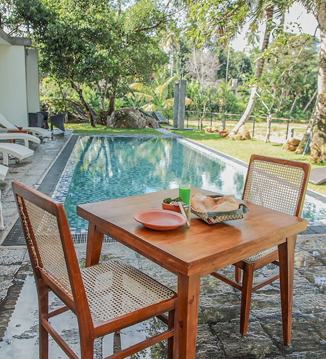 Food table arranged by the pool