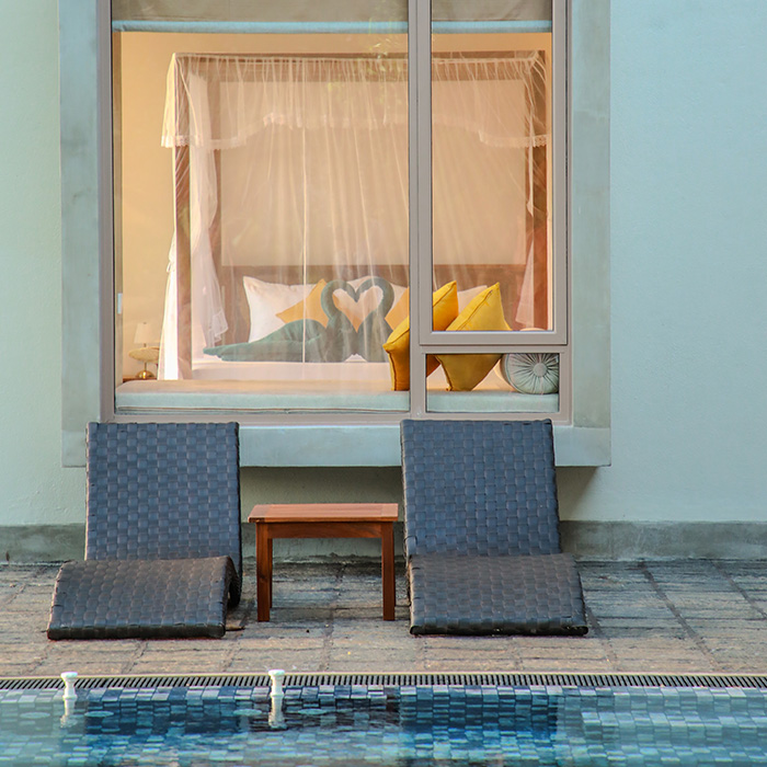 Two pool chairs by Ona Garden Villa pool