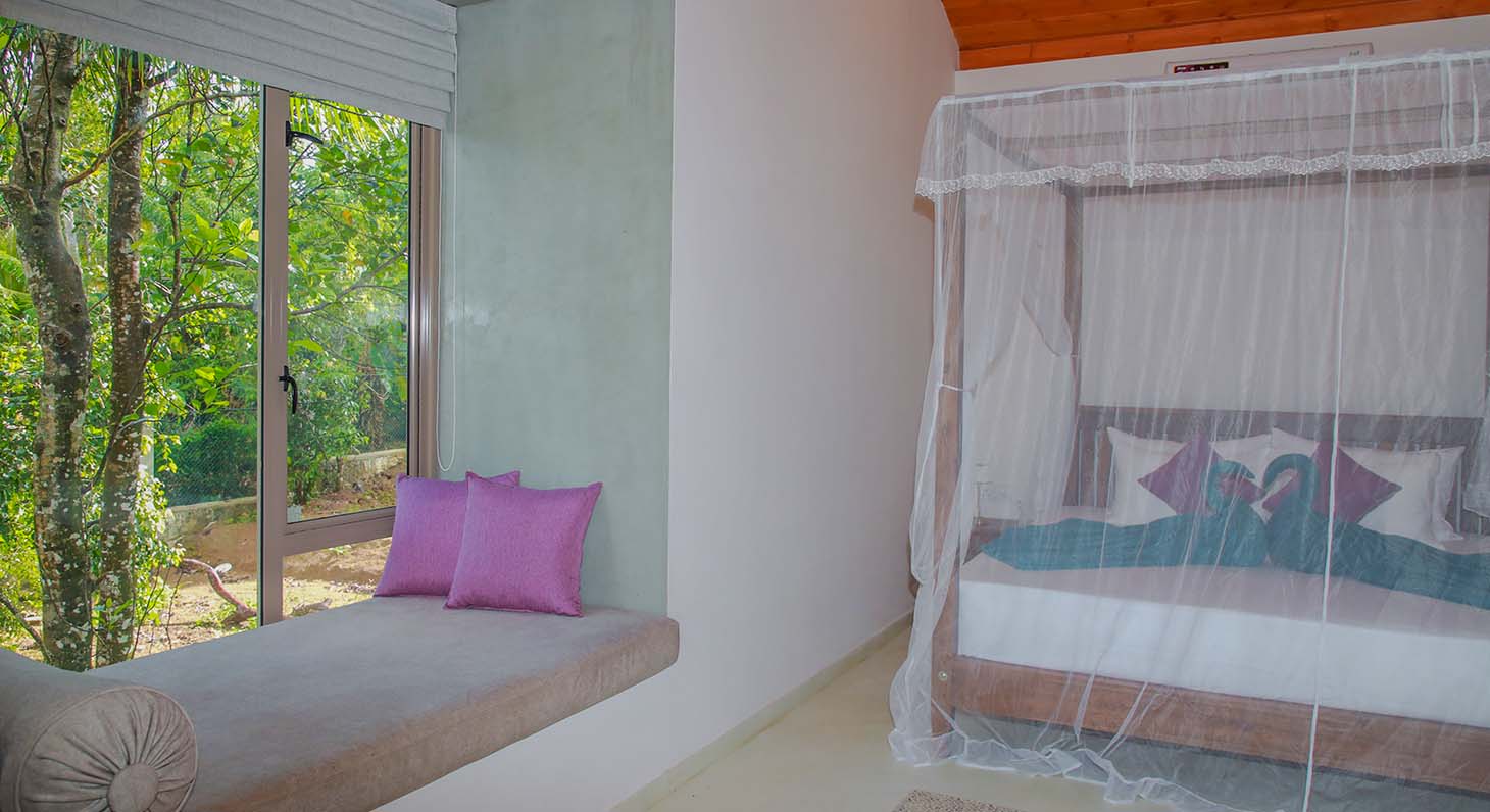 Bedroom setup with garden view at Ona Garden Villa