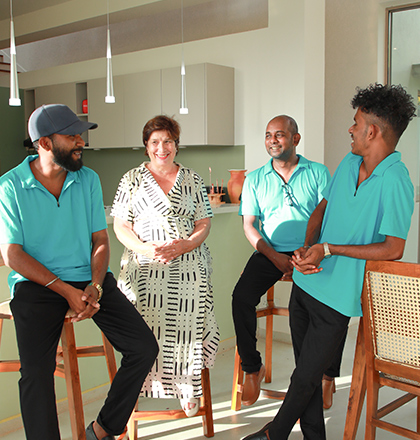 Owner Mrs Pia with workers